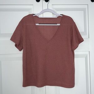 Mauve short sleeve crop top.